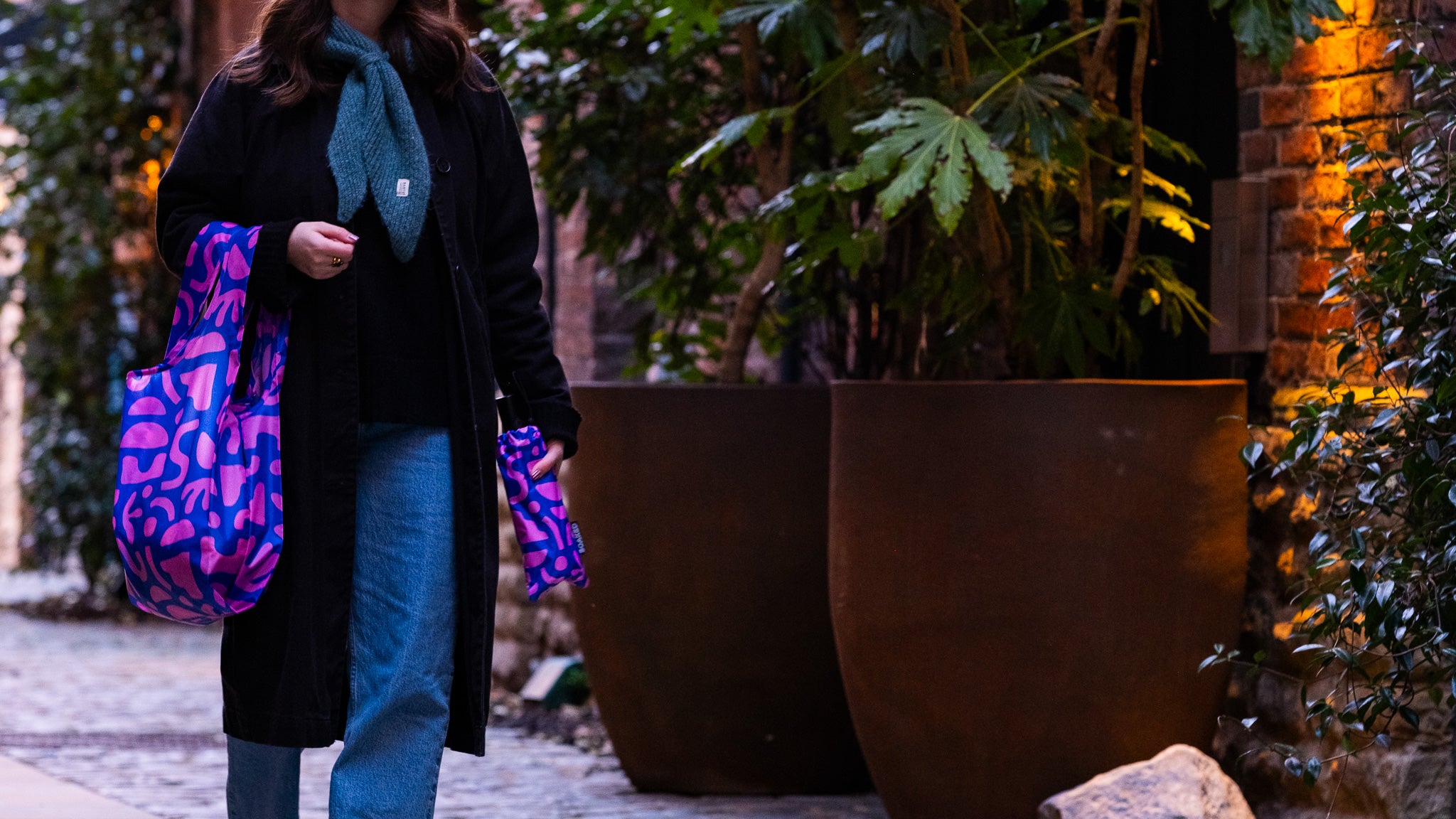Manchester's eco conscious umbrella brand SOAKED, showing vibrant patterned umbrella and tote bag bundle