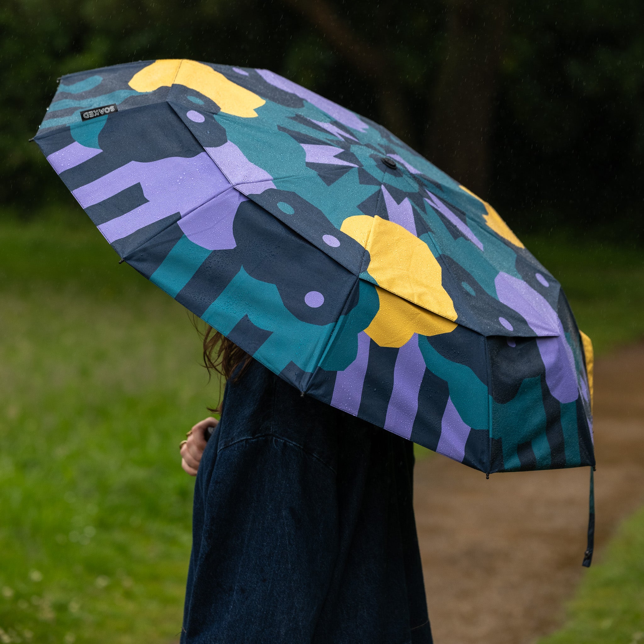 Full canopy view of SOAKED CLOUDBURST umbrella showing cloud-inspired design and recycled fabric canopy