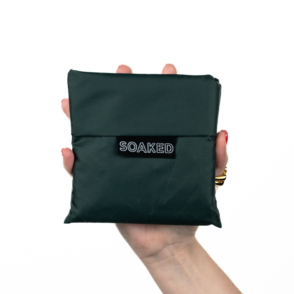 SOAKED Big Sur forest green tote bag folded small and compact, made from recycled plastic