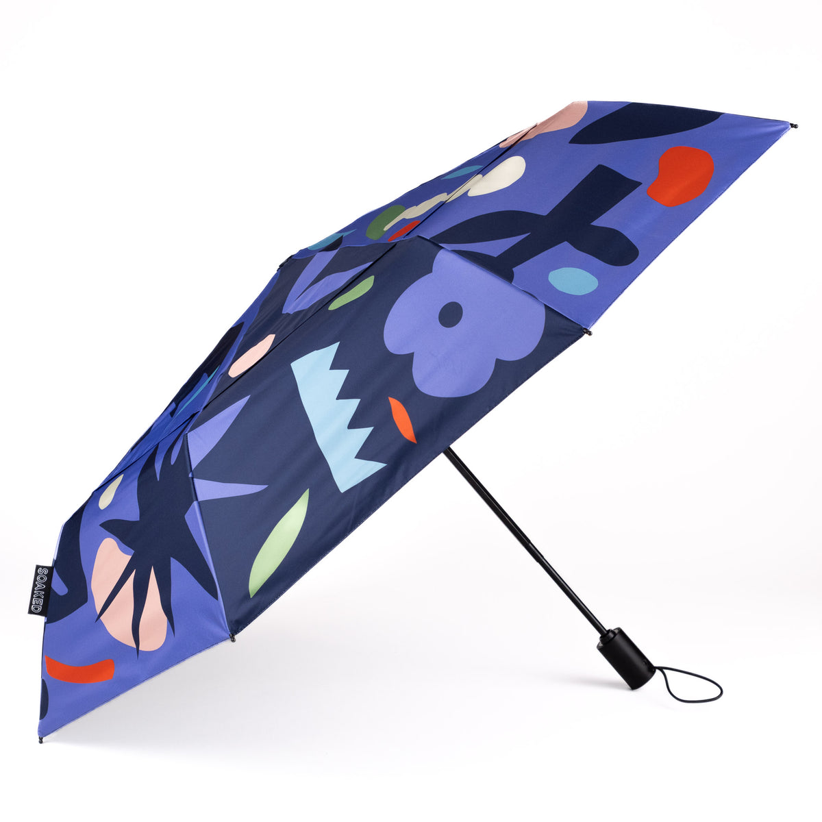 Side view of the vented, wind-resistant canopy on the SOAKED Block Party abstract blue and purple umbrella