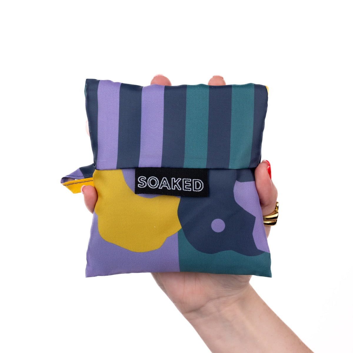SOAKED Cloudburst cloud and floral tote bag folded small and compact, made from recycled plastic