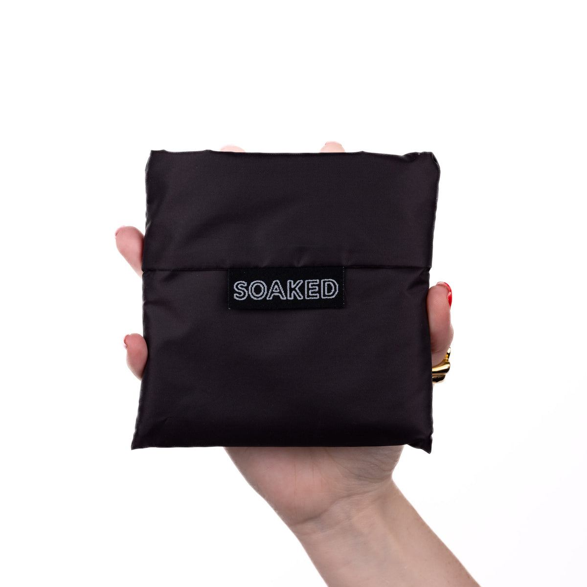 SOAKED Dark Skies black tote bag folded small and compact, made from recycled plastic