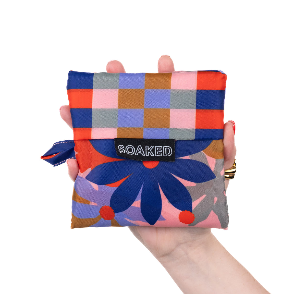 SOAKED Superbloom bold floral tote bag folded small and compact, made from recycled plastic