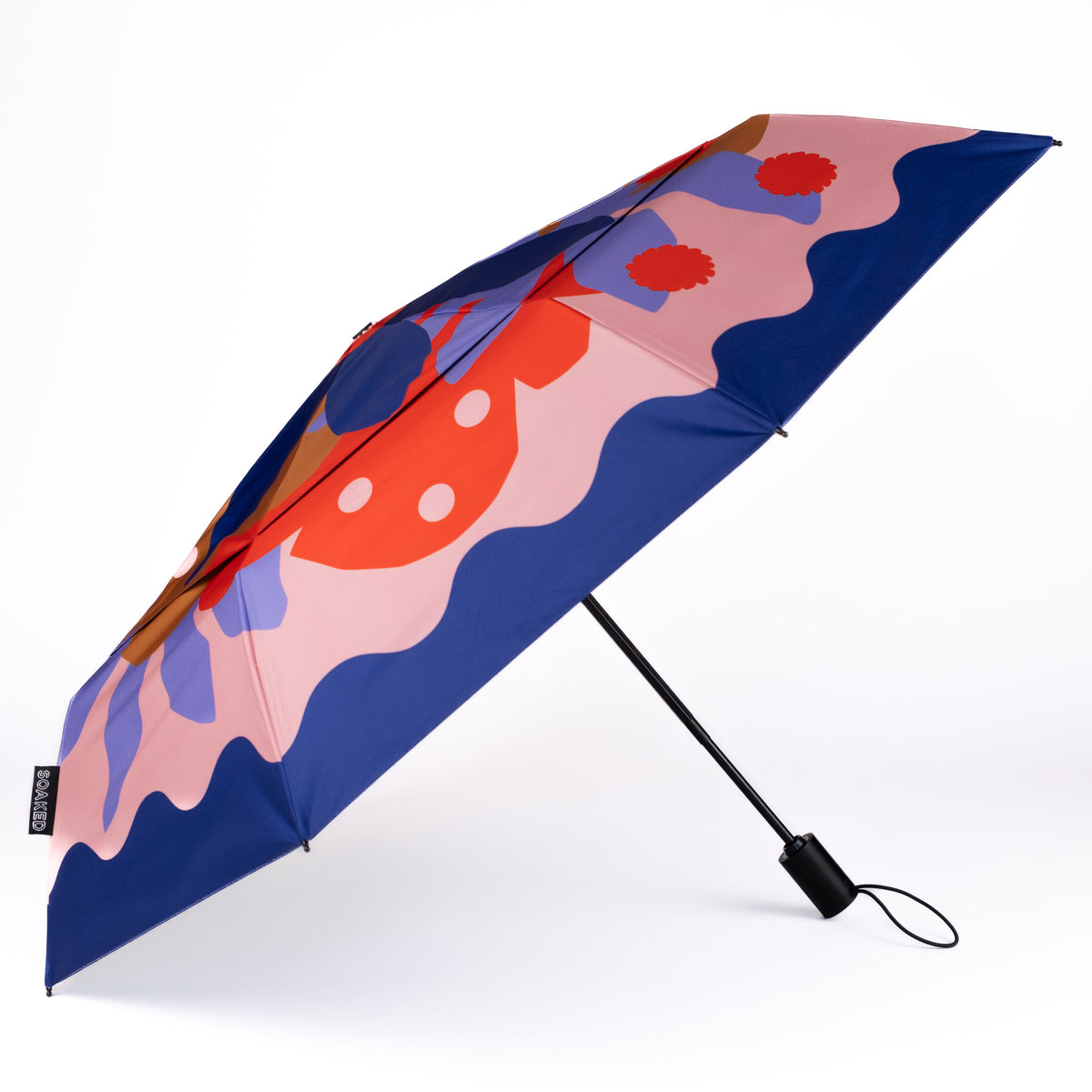 Side view of the vented, wind-resistant canopy on the SOAKED Superbloom bold floral umbrella