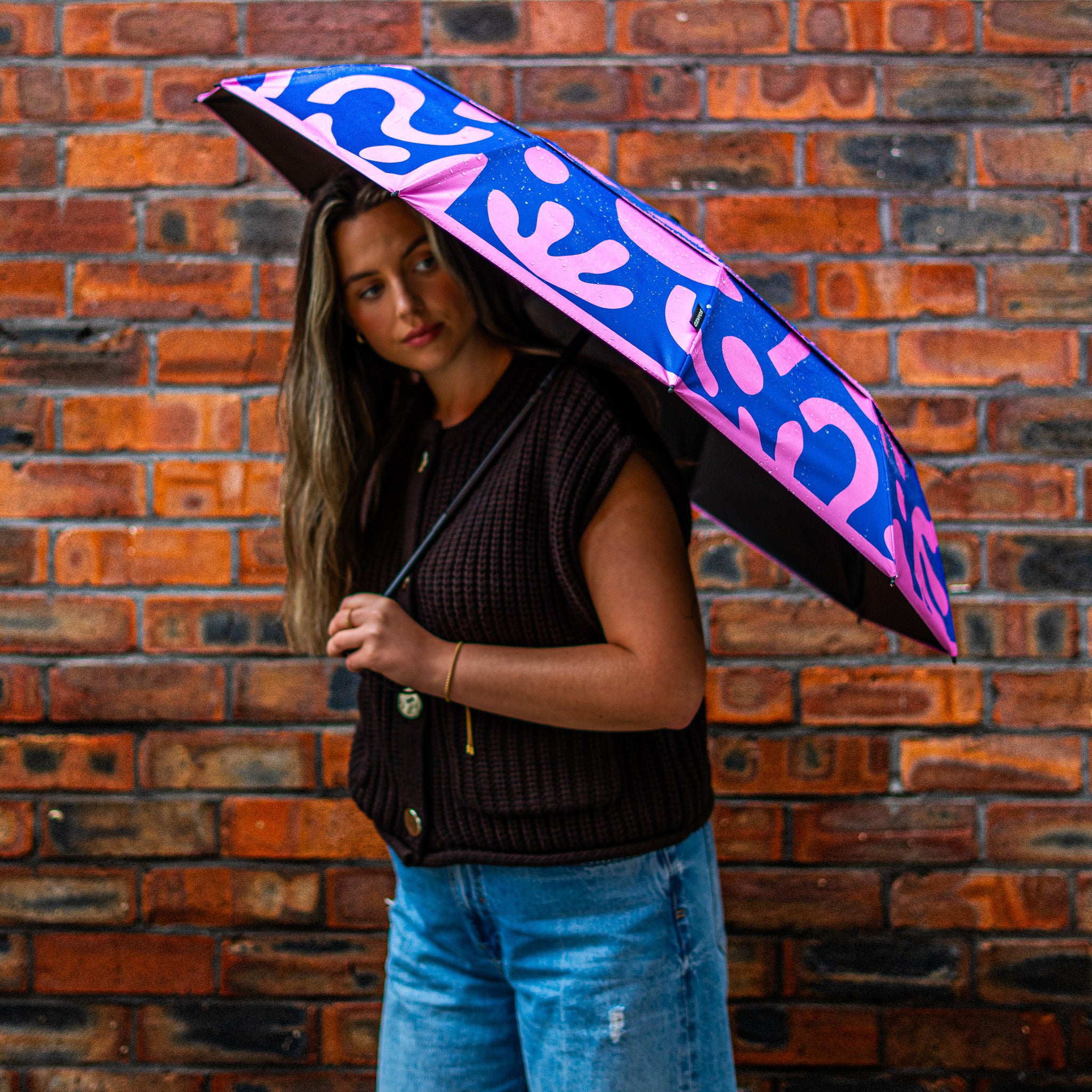 Wide canopy view of a SOAKED umbrella highlighting strong fabric and design