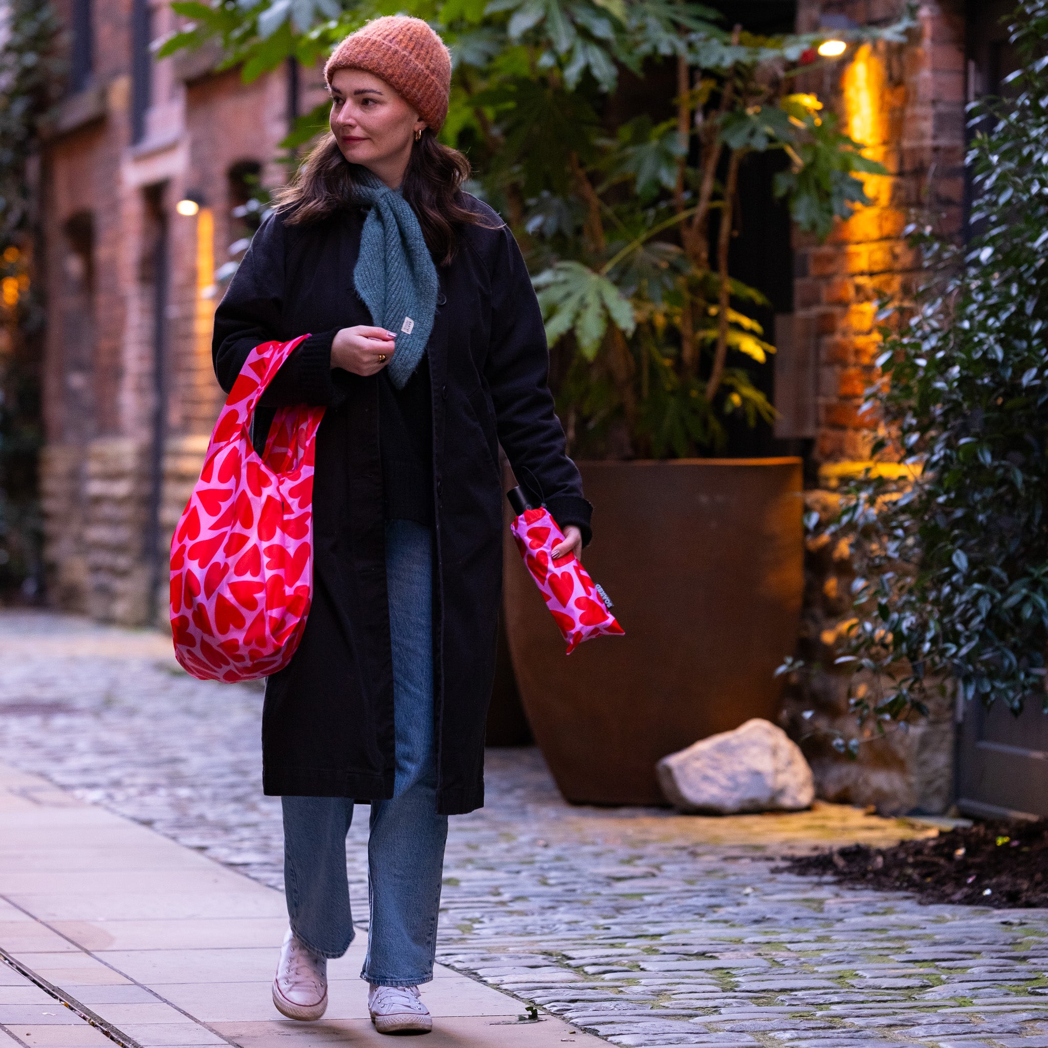 Colourful sustainable umbrella in rainy Manchester, illustrating the rainy city inspiration behind SOAKED umbrellas