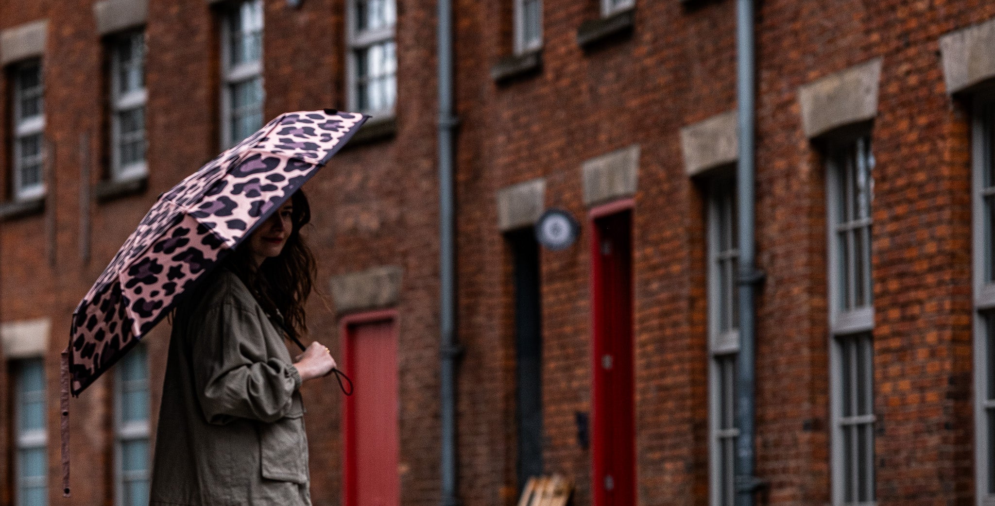 Close-up of SOAKED umbrella recycled fabric canopy with bold pattern and durable stitching