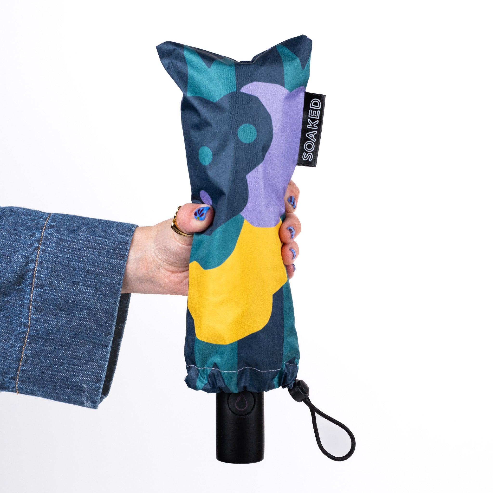 SOAKED CLOUDBURST compact travel umbrella folded for easy everyday carrying