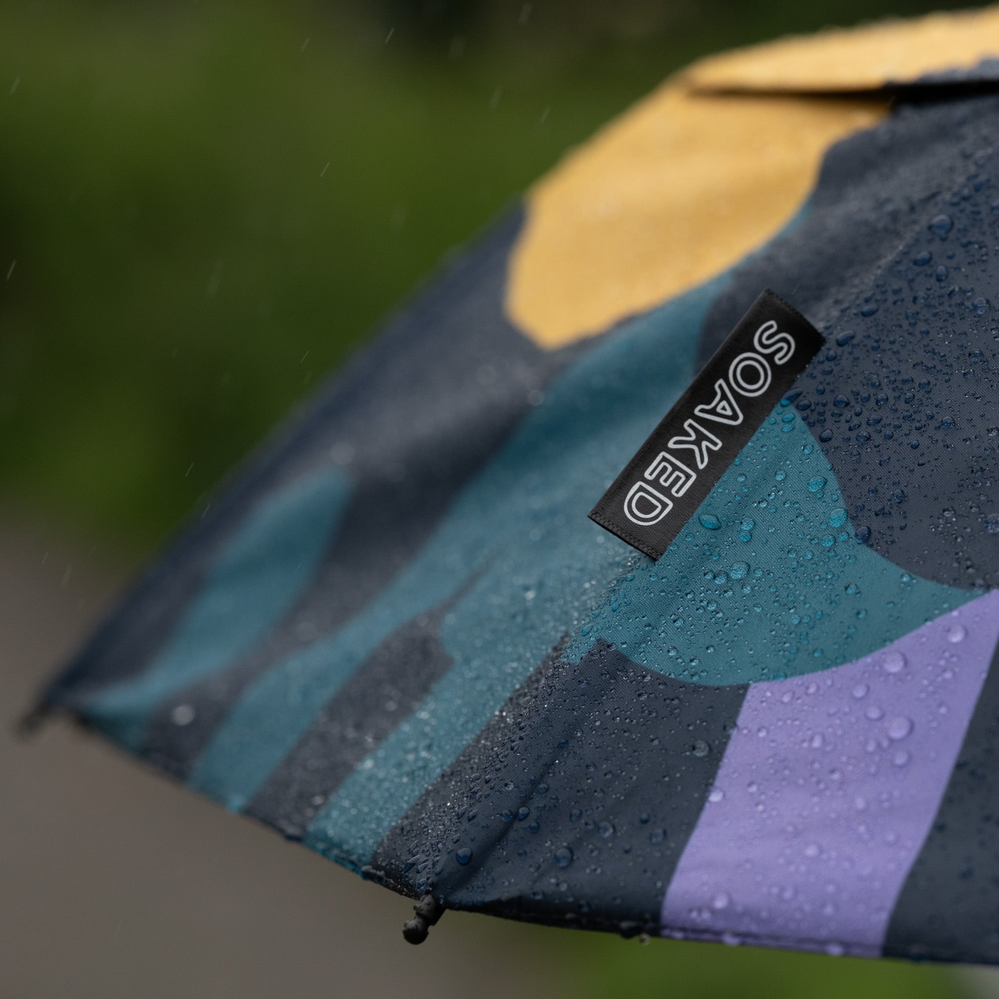 Recycled RPET canopy fabric used in the SOAKED CLOUDBURST sustainable umbrella