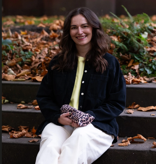 Meg, co-founder of SOAKED Umbrellas, in Manchester holding a windproof Wild Thing umbrella