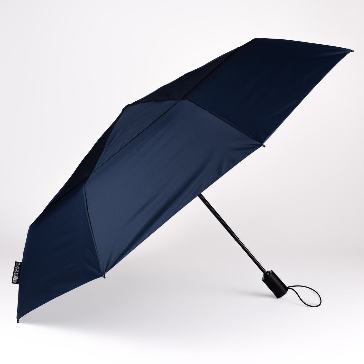 Side view of the vented, wind-resistant canopy on the SOAKED Atlantic navy umbrella