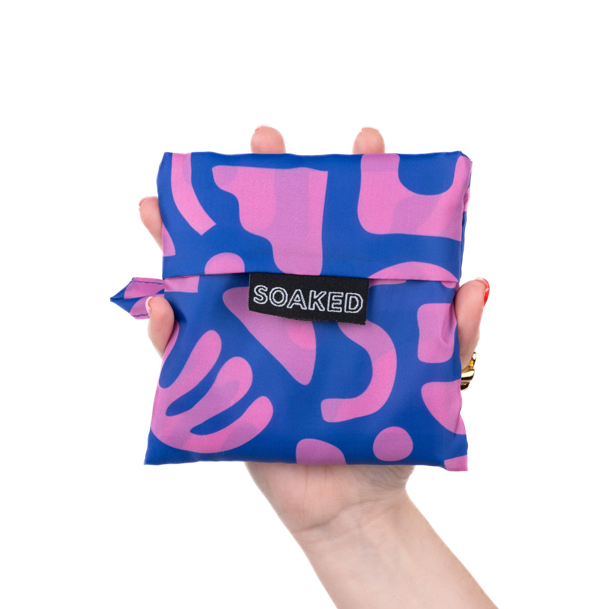 SOAKED Bits and Bobs purple and blue tote bag folded small and compact, made from recycled plastic