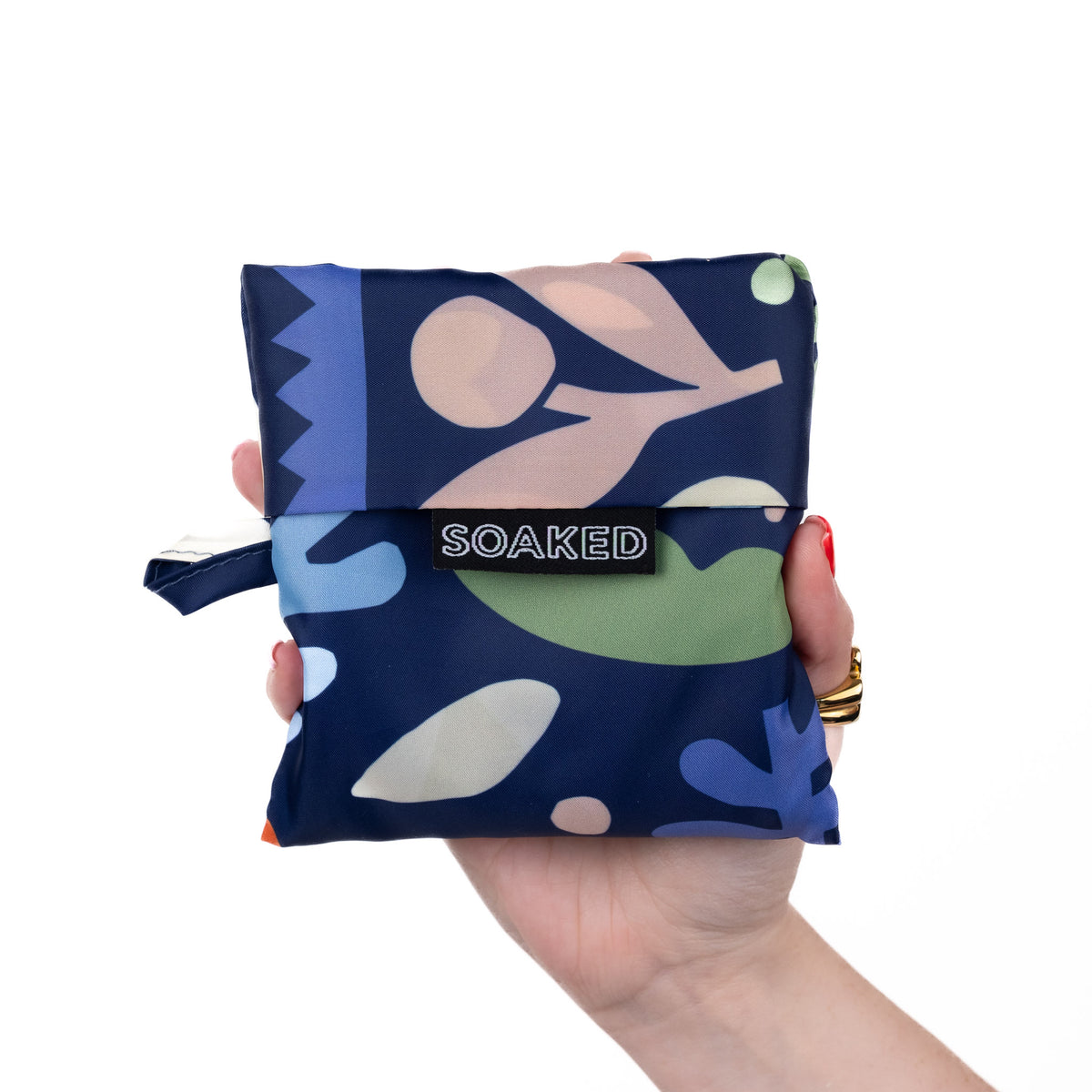 SOAKED Block Party abstract blue and purple tote bag folded small and compact, made from recycled plastic