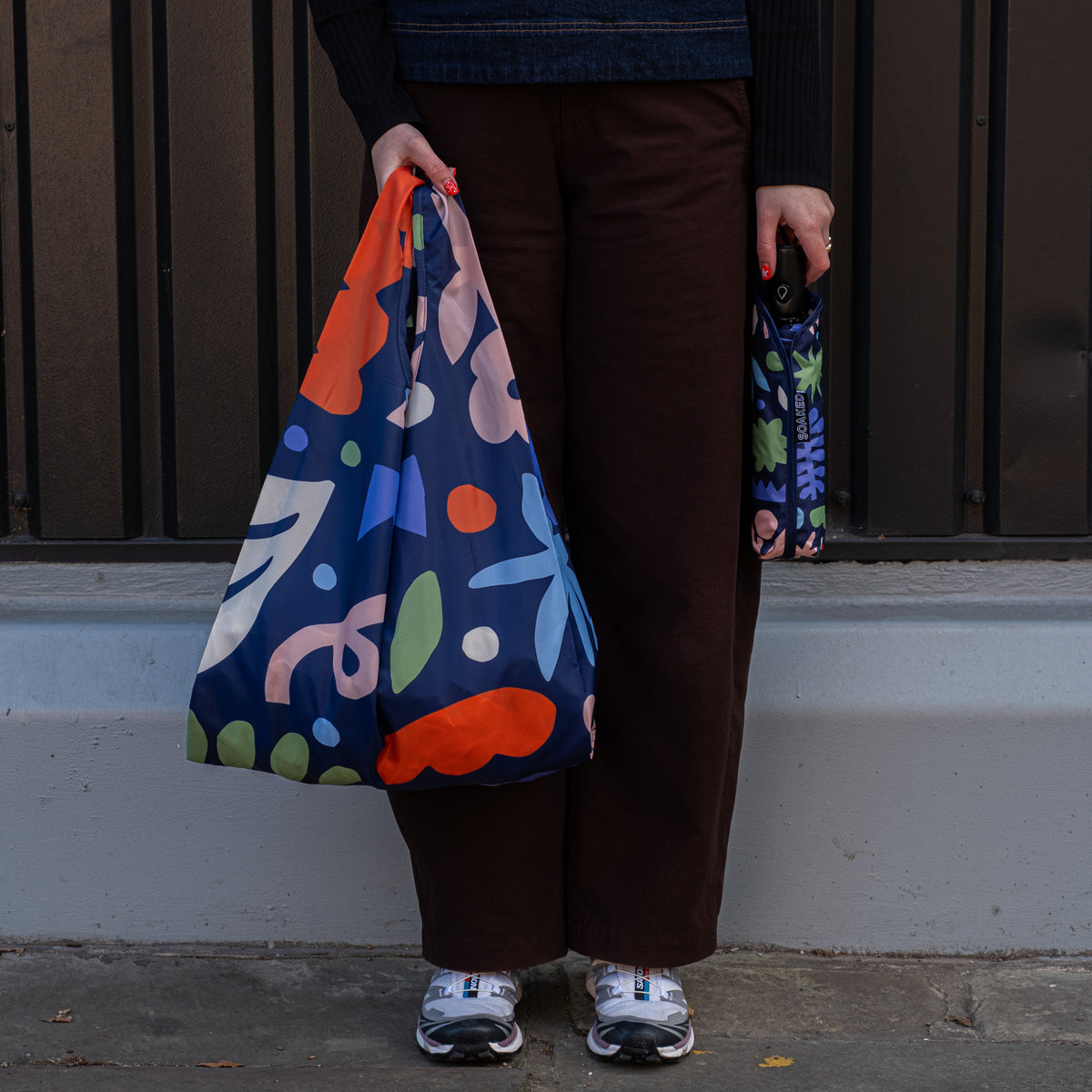 SOAKED Block Party abstract blue and purple umbrella and matching recycled tote bag set, folded small