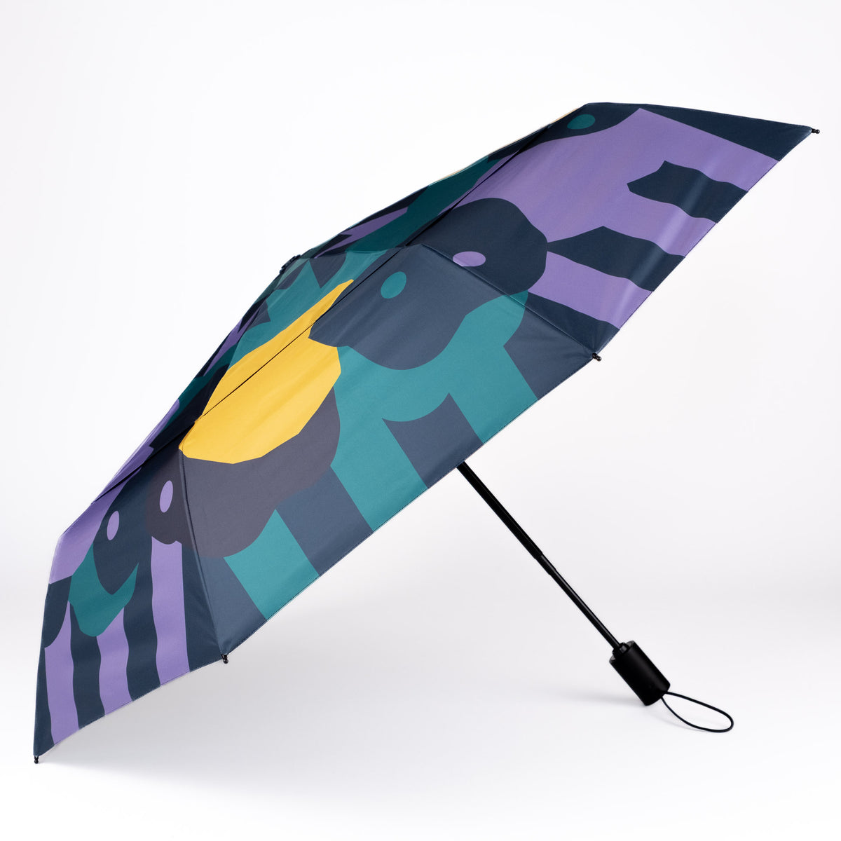 Side view of the vented, wind-resistant canopy on the SOAKED Cloudburst cloud and floral umbrella