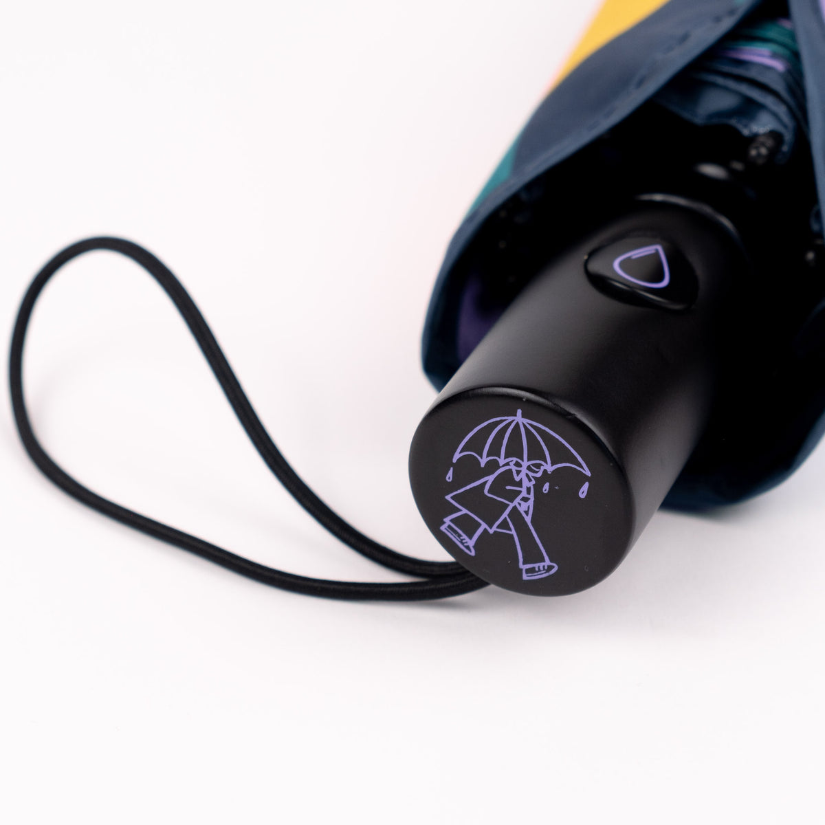 Close-up of the FSC-certified wooden handle and raindrop button on the SOAKED Cloudburst umbrella