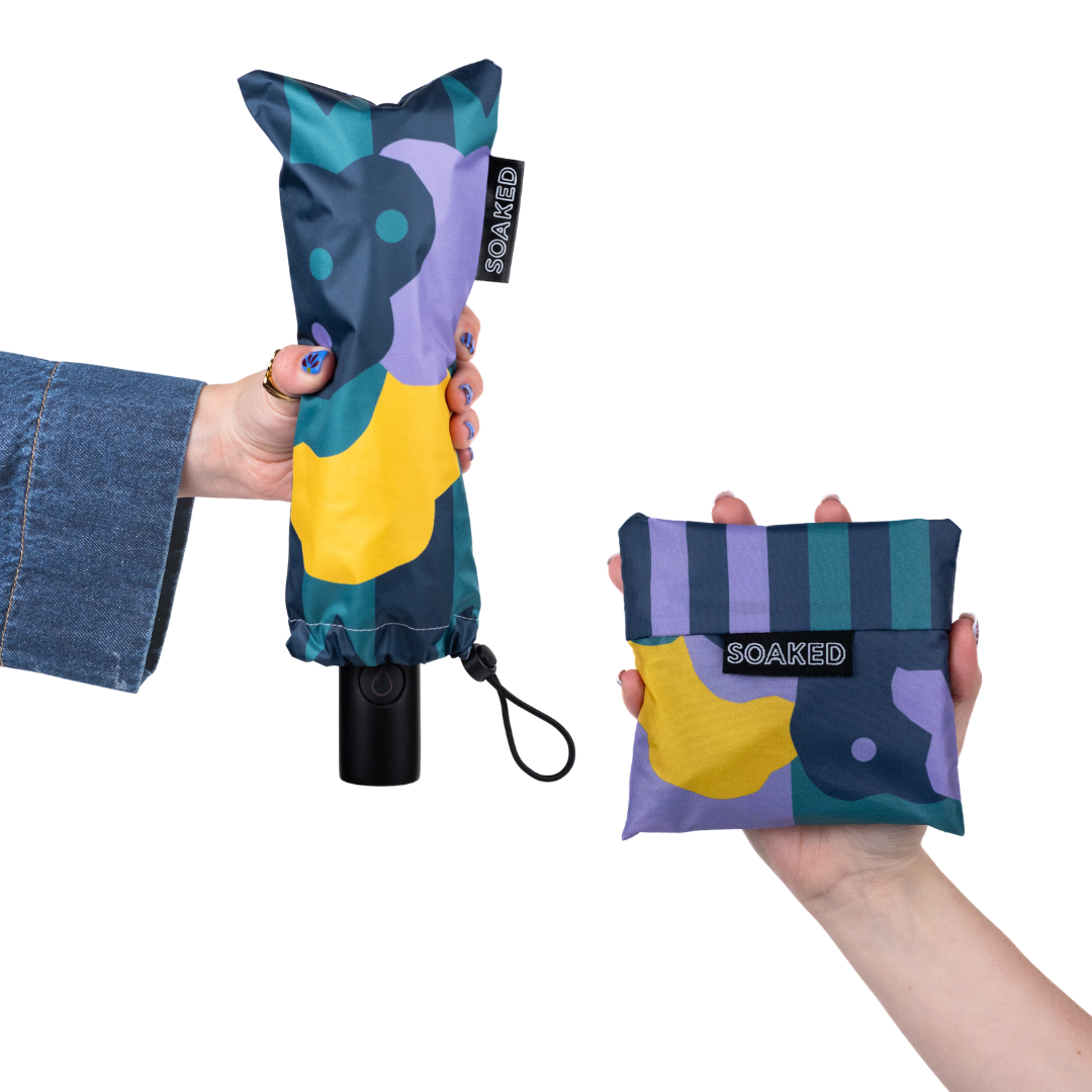 SOAKED CLOUDBURST umbrella and reusable shopping bag bundle featuring matching cloud-inspired print