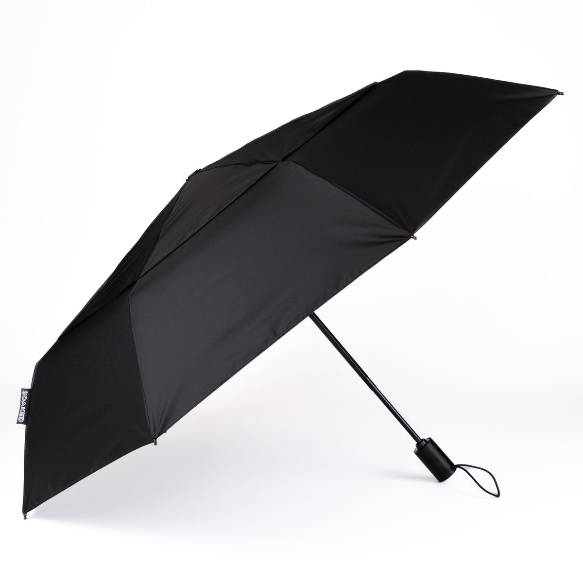 Side view of the vented, wind-resistant canopy on the SOAKED Dark Skies black umbrella