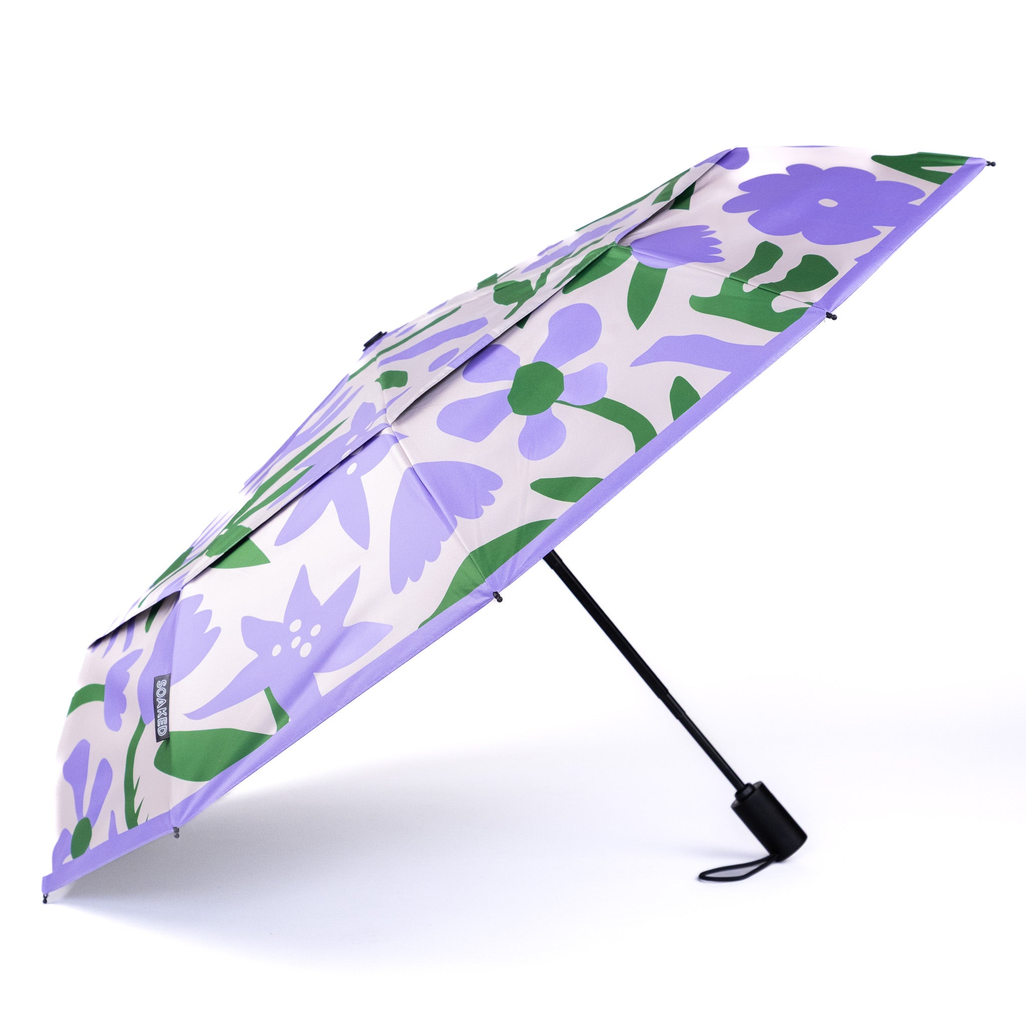 SOAKED Wildflowers umbrella open against a light background, showing the full floral canopy print — wind-resistant eco umbrella, Manchester