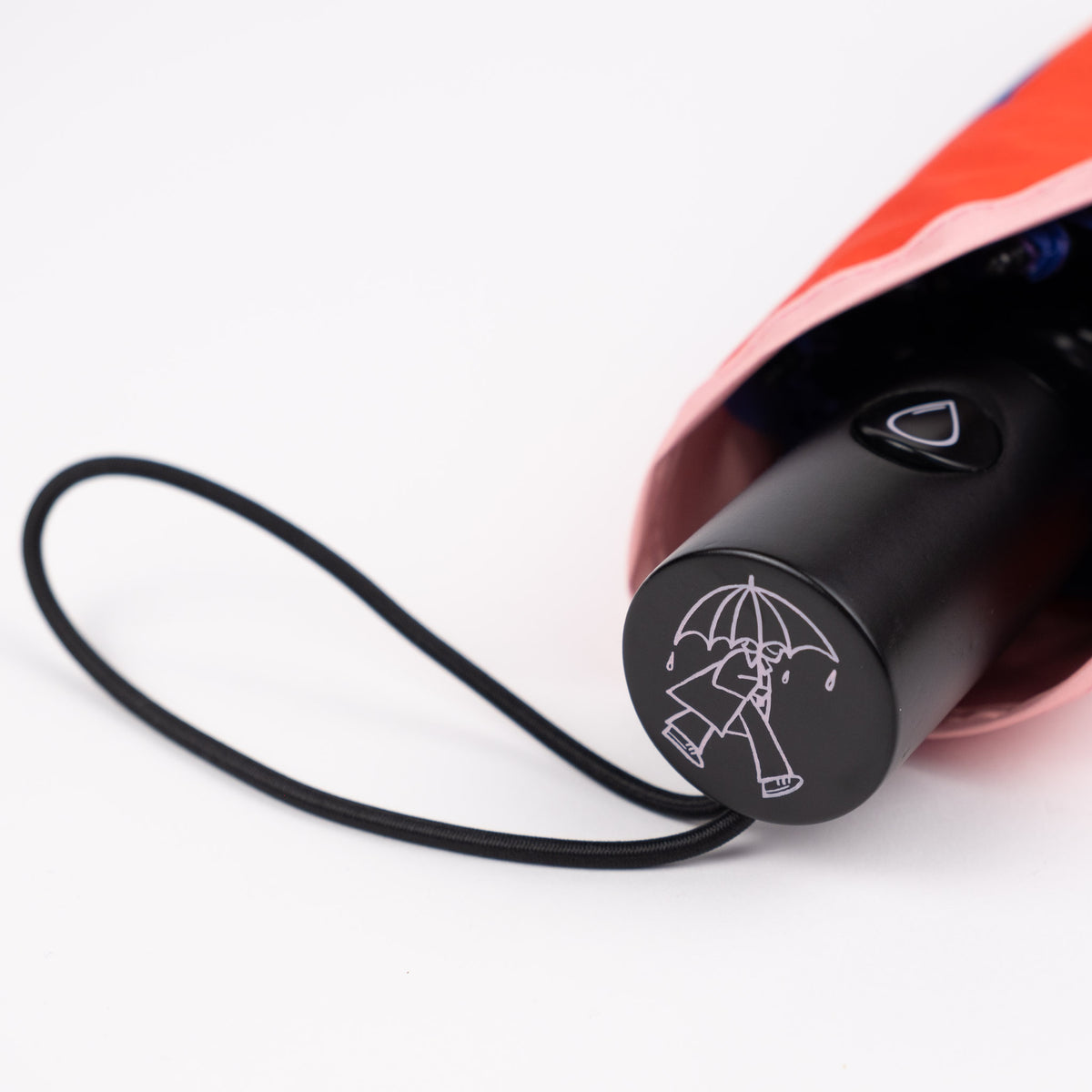 Close-up of the FSC-certified wooden handle and raindrop button on the SOAKED Superbloom umbrella