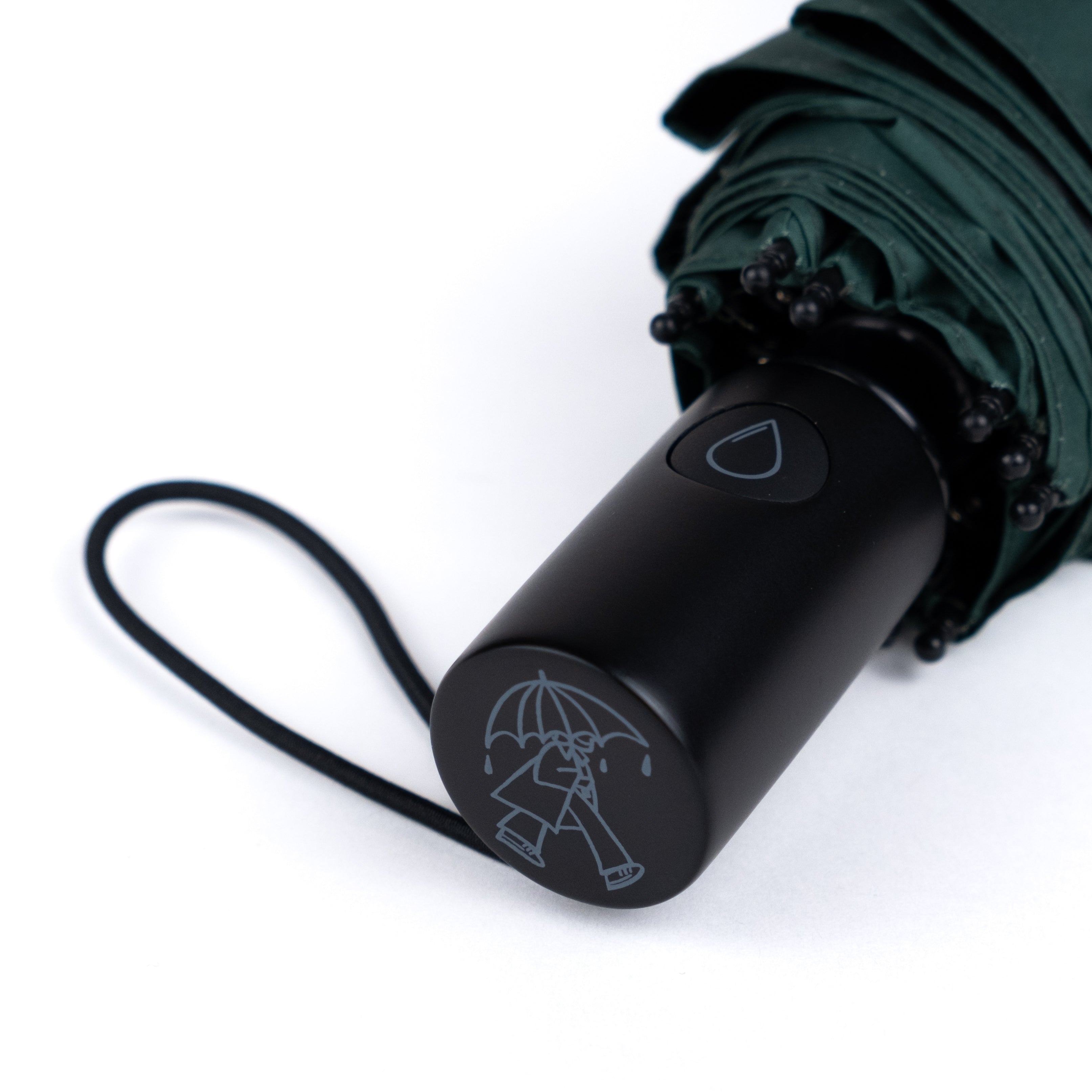 Close-up of SOAKED umbrella handle crafted from smooth natural wood