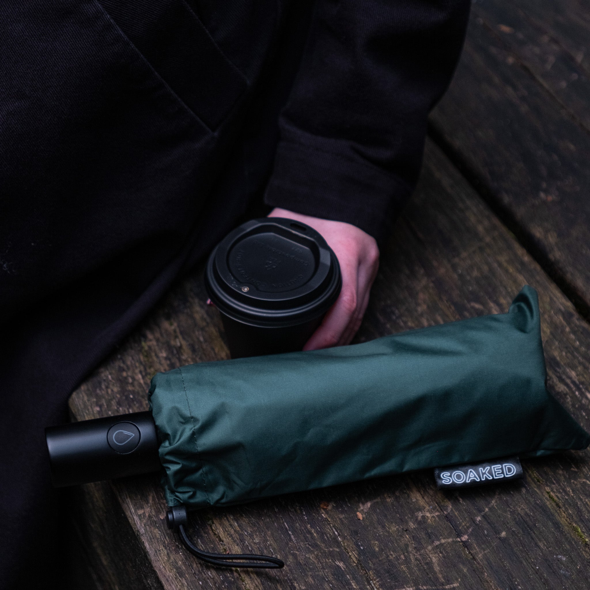 SOAKED compact umbrella folded size comparison showing generous coverage and easy portability