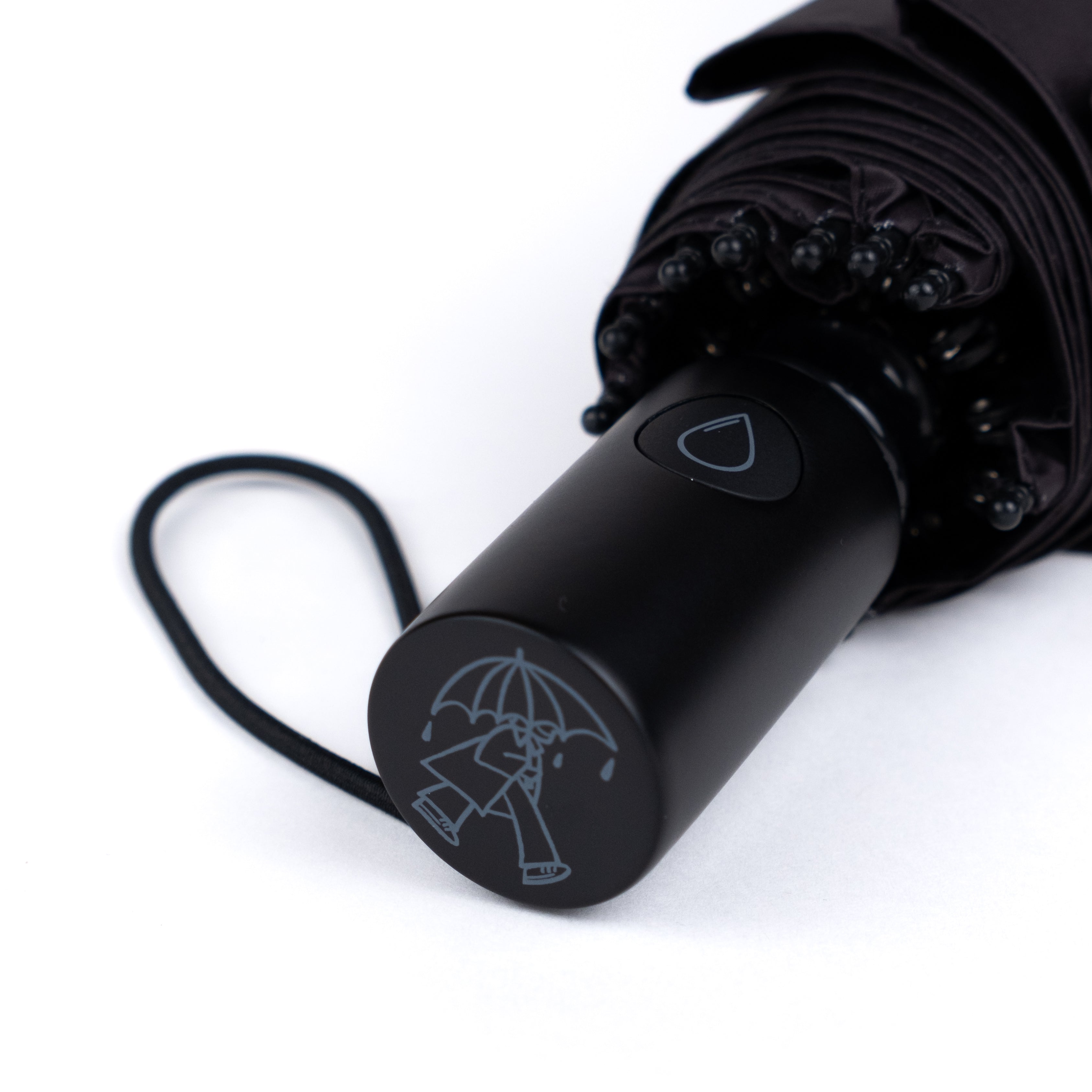 Close-up of SOAKED umbrella wooden handle showing care for premium natural materials