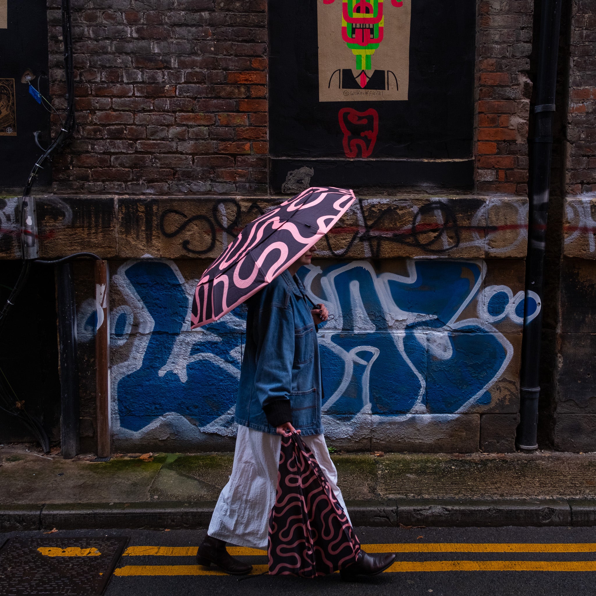 SOAKED Doodle sustainable umbrella paired with coordinated recycled bag for rain and errands