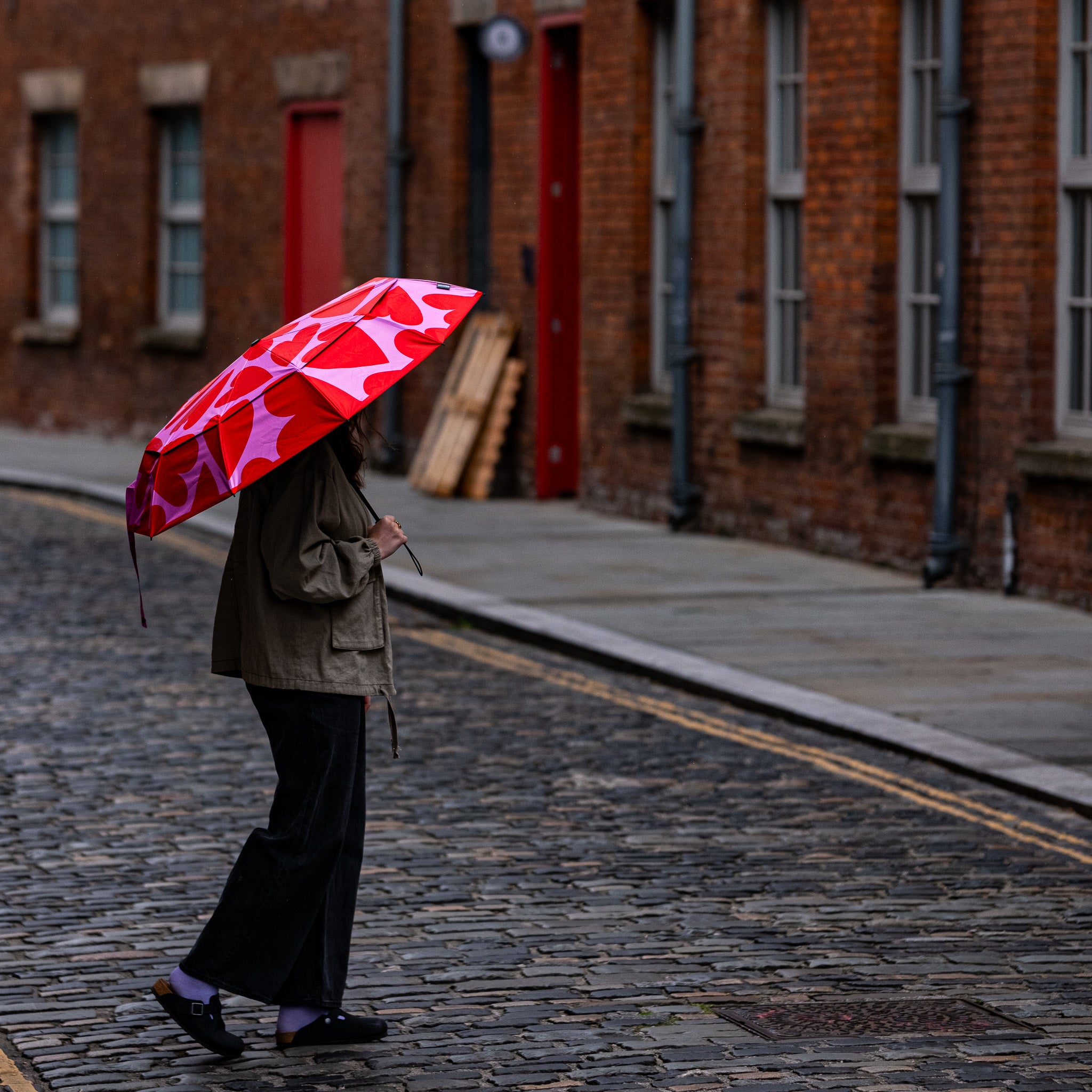 SOAKED LOVE BUG hearts sustainable umbrella with wooden handle Manchester street.