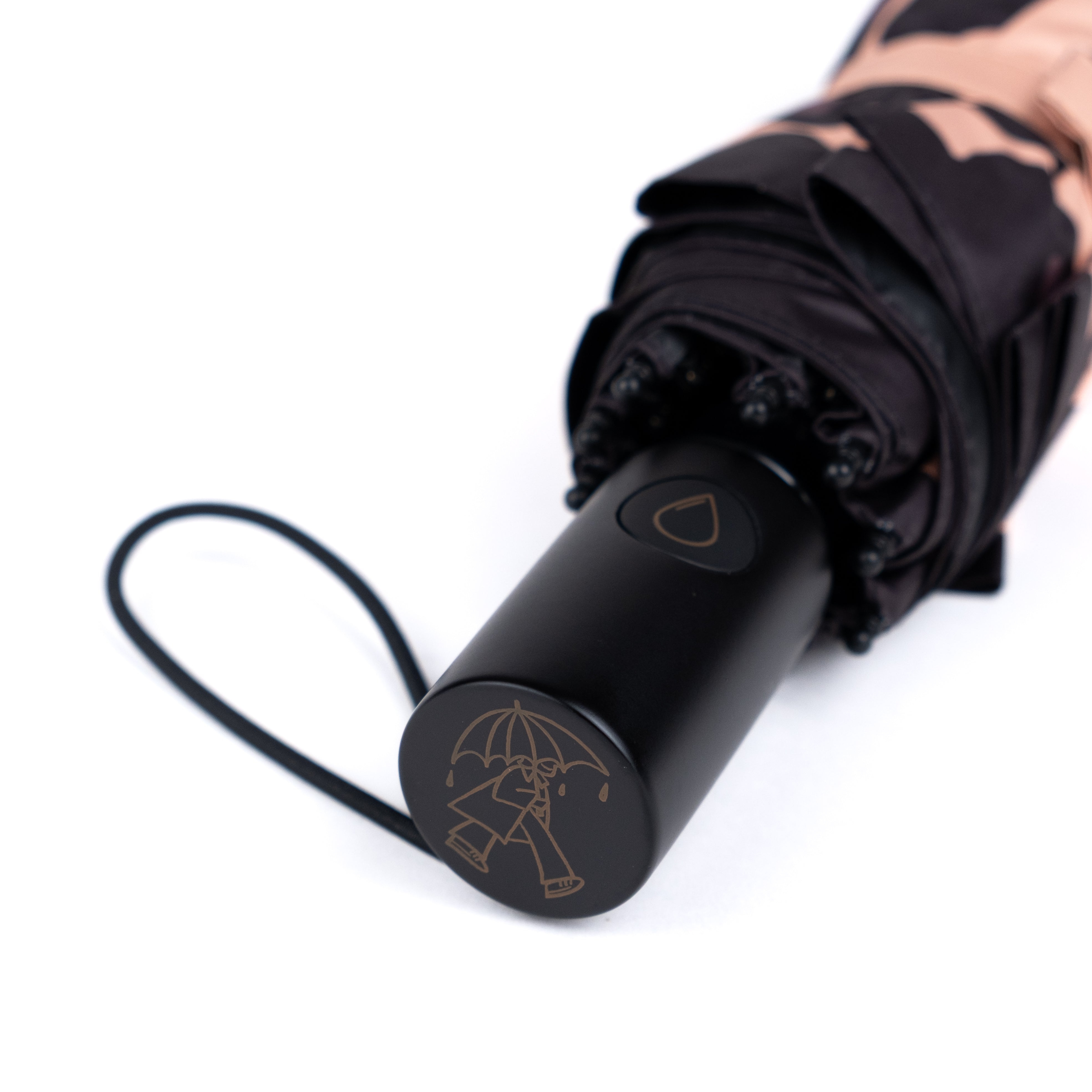 Smooth wooden handle detail from a SOAKED premium umbrella